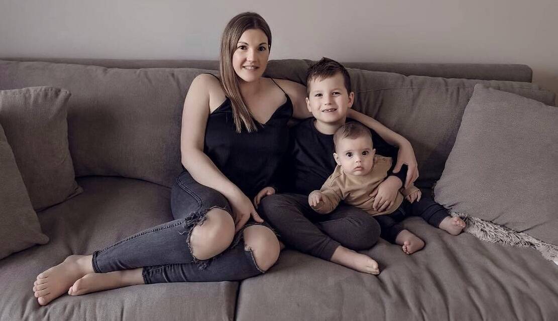 TAKING UP THE CHALLENGE: Sarah Lee, with sons Braxton, 6 and Jimmy, 7 months, is crunching to help beat cancer. Picture: SUPPLIED