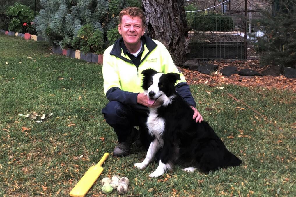 A FAVOURITE: Mark Radford with Ollie, who likes playing the tennis ball game. PICTURE SUPPLIED