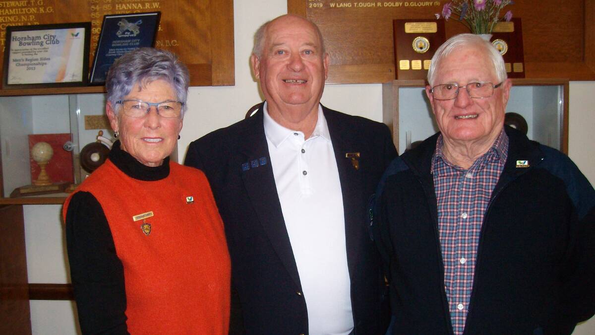 Super veteran: Betty Cozens, Stewart Landwehr and Tom Clancy at the presentation of their badges.