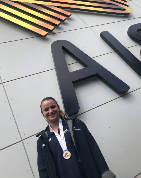 INSPIRED: Cleo Baker, with the silver medal she won in the Australian Junior Volleyball Championships which she says will drive her to become a better player.