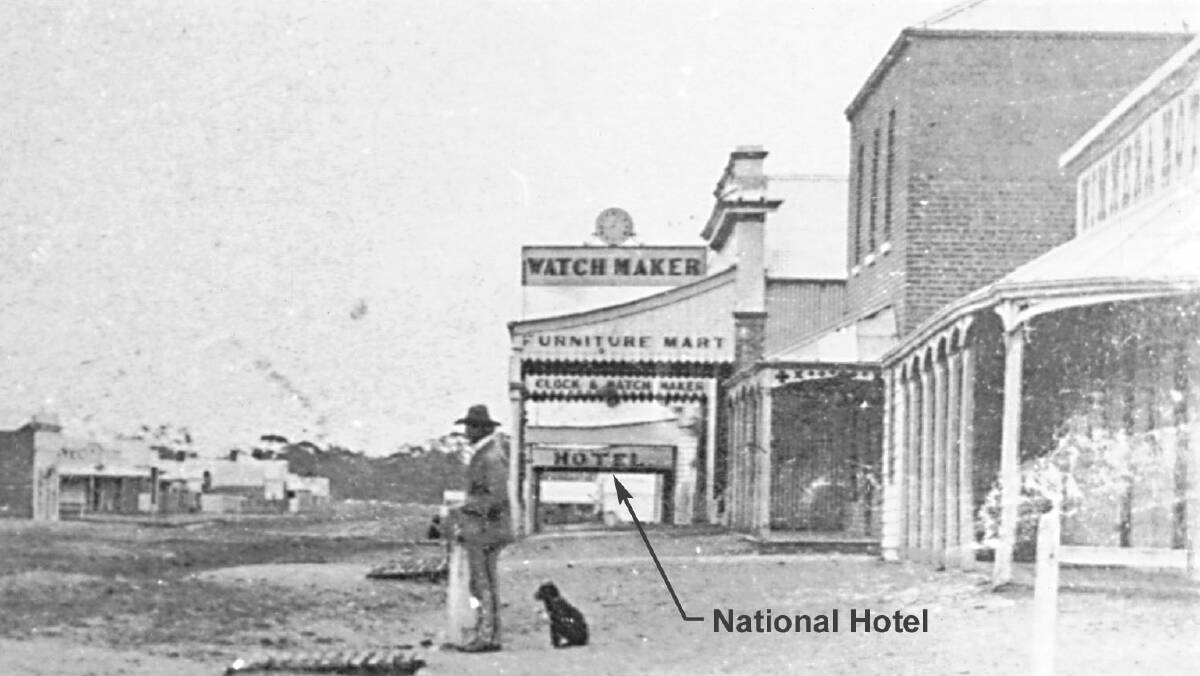 A BYGONE ERA: View to east along Wilson Street from Firebrace Street, taken about 1877. Note the sign for the National Hotel at 35 Wilson Street. Source: HHS: 002622.