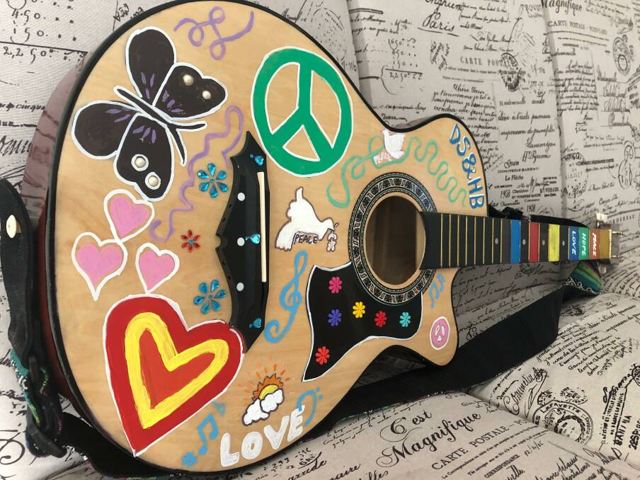 HIPPIE GUITAR: The Mamma Mia! prop was put aside for a bit while I hung out with my daughters. 