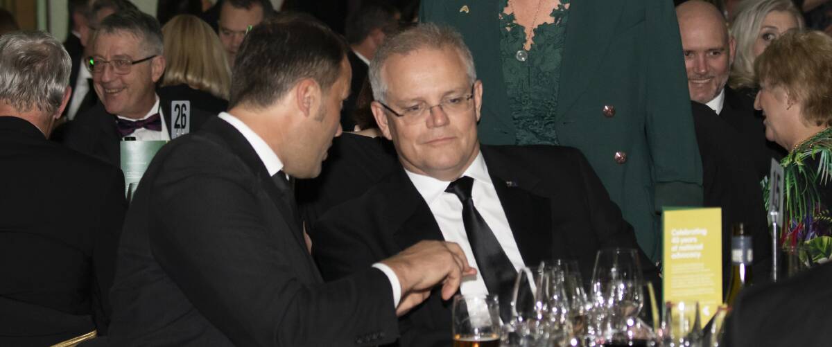 WHAT'S ON THE TABLE?: VFF president David Jochinke talks to Prime Minister Scott Morrision about key issues for our state and the Wimmera during the National Farmers' Federation 40th anniversary dinner. Picture: SUPPLIED