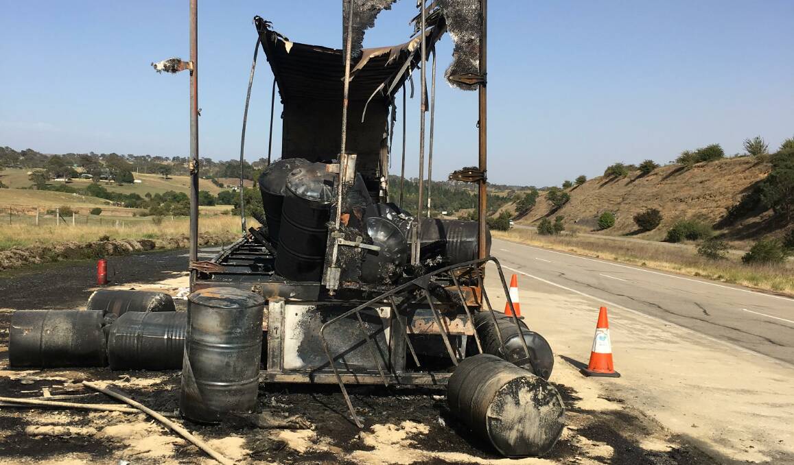 A burnt-out truck on the Federal Highway. Picture: Peter Brewer 