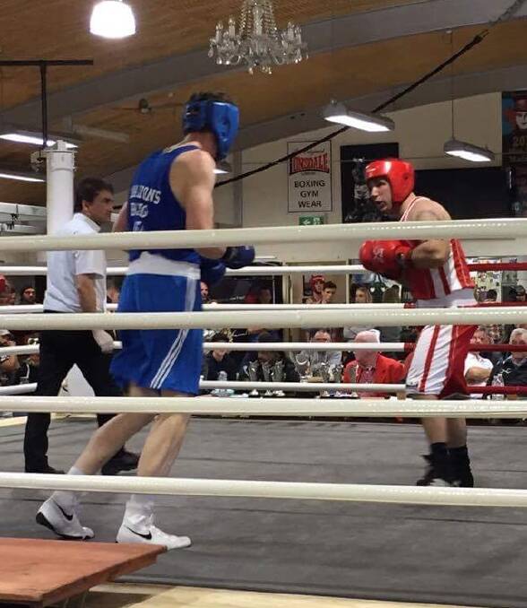 TOUGH COMPETITOR: Luke Preston (Red) in action during his first boxing bout in Ringwood at the weekend. 