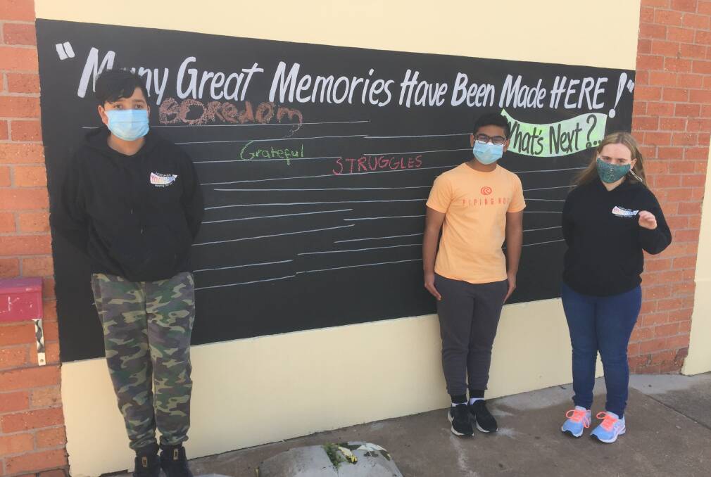 A NEW WAY TO MAKE MEMORIES: Horsham Youth councillors Shivansh Bhutani, Tom Luke and Scarlett Munday-Terry at 'the Station', - formerly the Nexus Youth Centre - with one word they would use to sum up the pandemic. Picture: ALEXANDER DARLING
