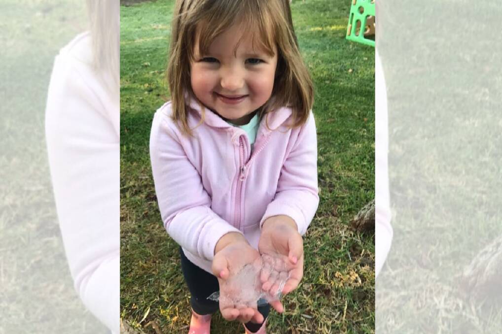 COOL: Kaniva's Tallulah Dyer, aged 4, with some of the ice from Wednesday's morning frost. Picture: CONTRIBUTED