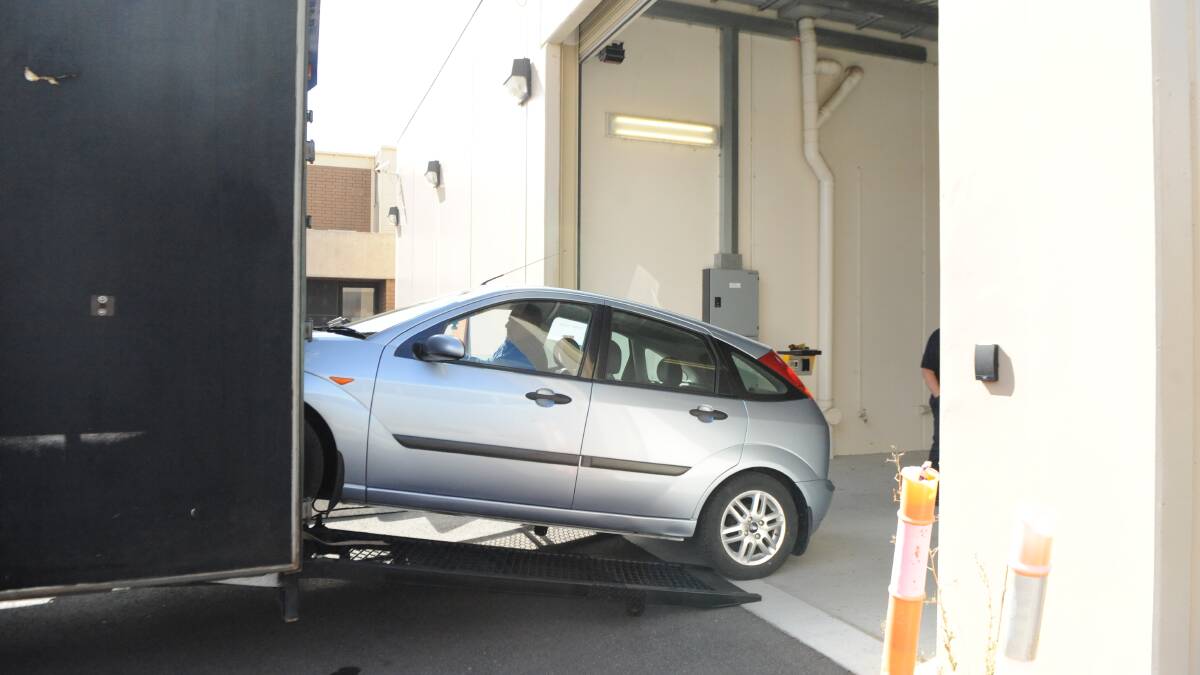 TAKEN FOR ANALYSIS: A sliver Ford Focus seized by Horsham Police on Wednesday is loaded into a truck at Horsham Police Station. Picture: ALEXANDER DARLING