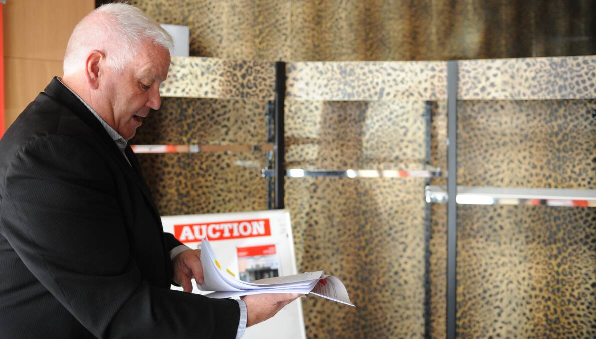 SPECIAL PROPERTY: Tim Coller at the auction at Audene's Boutique on Friday.