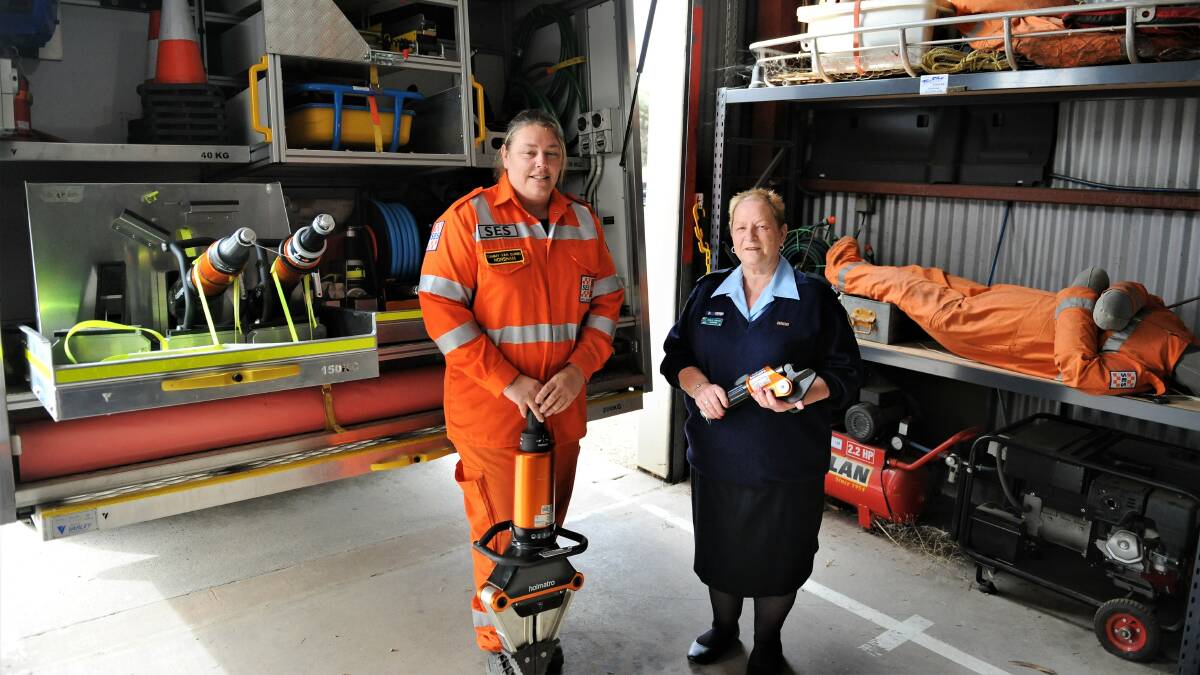SES-sational: Horsham Unit volunteer Tammy Van Duren with a "Jaws of life" Holamatro spreader and deputy controller and committee member Nola Smith with a Pedal Cutter. Picture: ALEXANDER DARLING