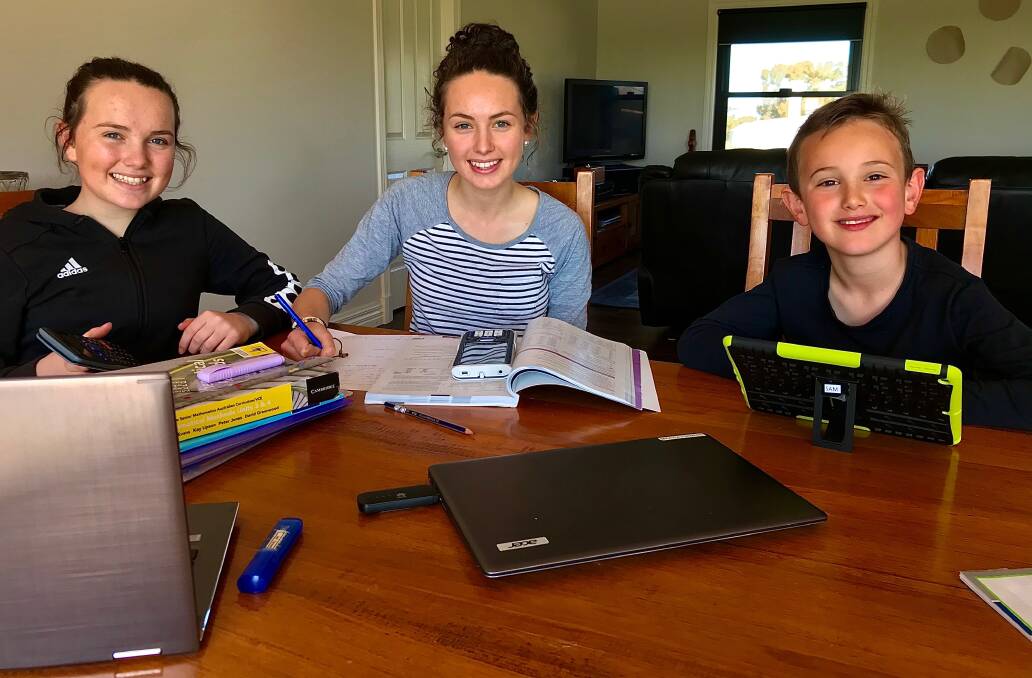 FULL HOUSE: Nhill VCE student Mikayla Farmers, centre, with sister Lexi, in year nine, and brother Sam, in year one. Picture: CONTRIBUTED