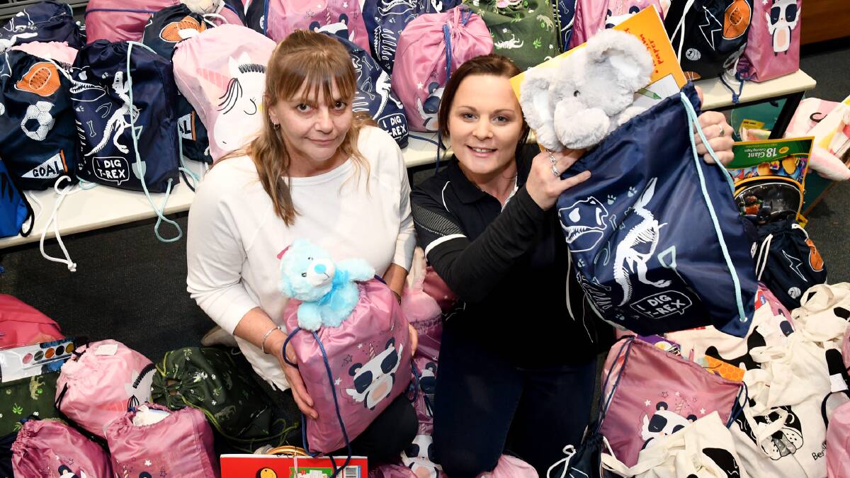 GENEROSITY: Diploma of Community Services student Rachel Krause, and SalvoConnect Western Horsham crisis support worker Renae Shanaughan, with kids care packs. Picture: SAMANTHA CAMARRI