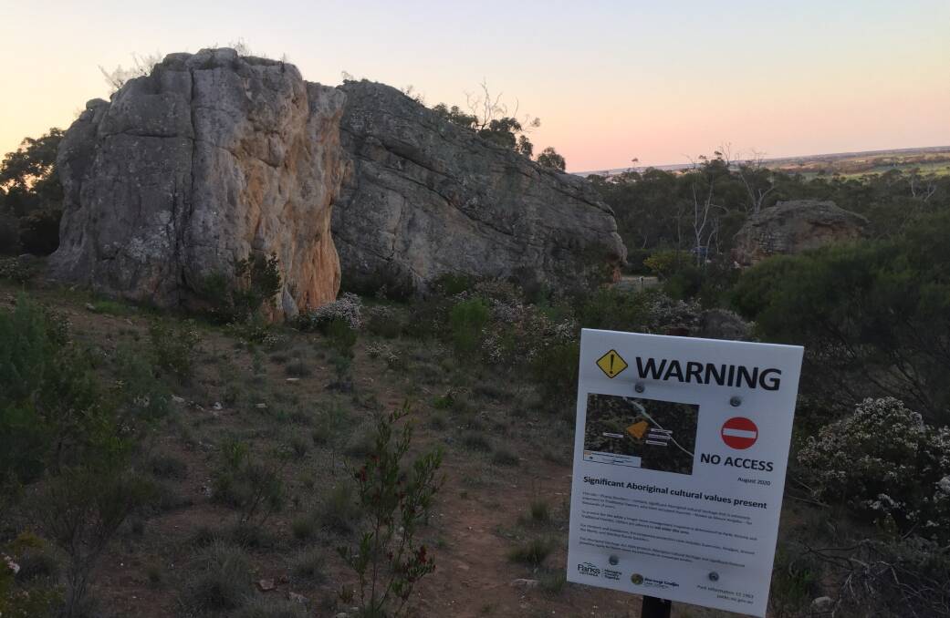 PROTECTION IN PLACE: A sign at the edge of the Around the World boulder on the eastern edge of Mount Arapiles. Picture: ALEXANDER DARLING