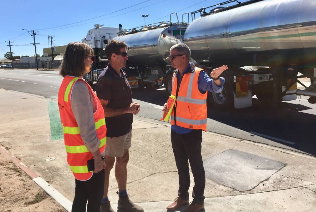 TRAFFIC FLOW: Regional Roads Victoria western region acting operations manager Angela Carey with roundabout user James Murphy and RRV senior projects engineer Troy Berry on Friday. Picture: ALEXANDER DARLING