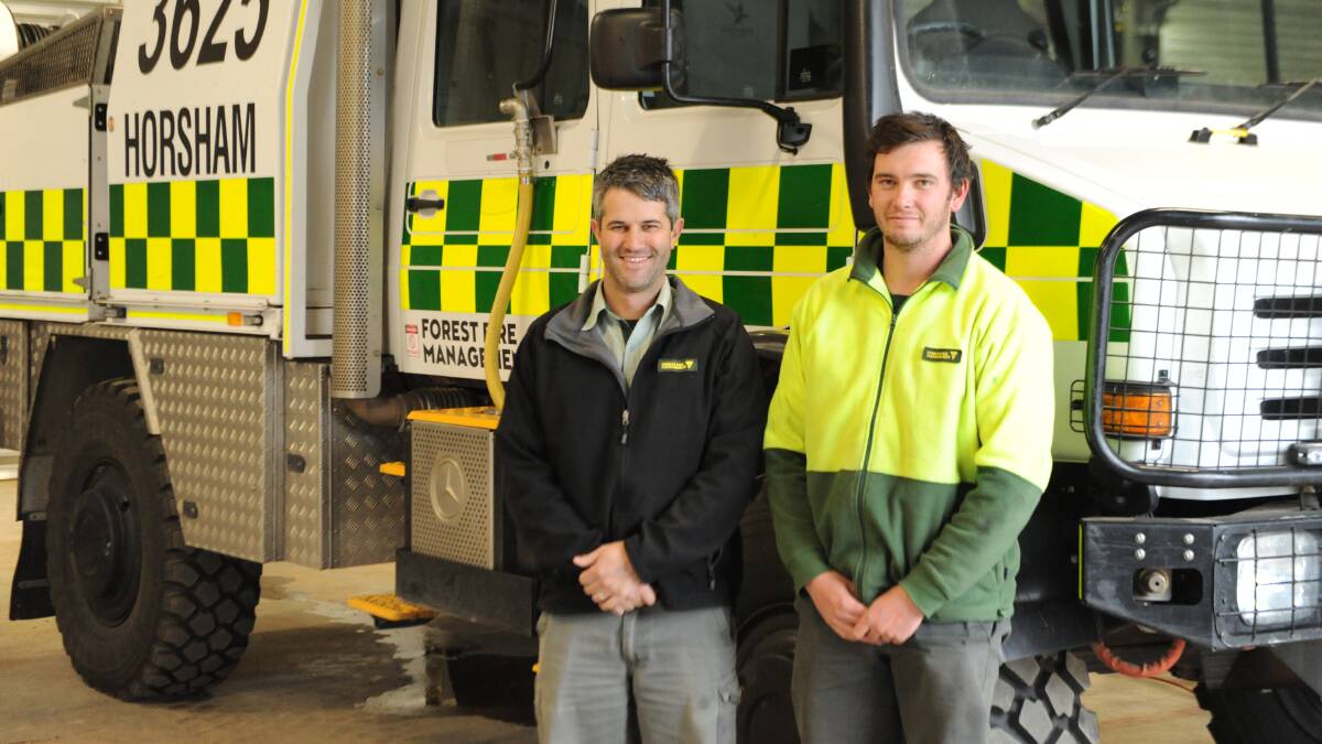FULFILLED: Forest Fire Management Victoria Horsham operations officer Andrew Wall and project firefighter David Elliott with the 4000-litre Unimog tanker. Picture: ALEXANDER DARLING