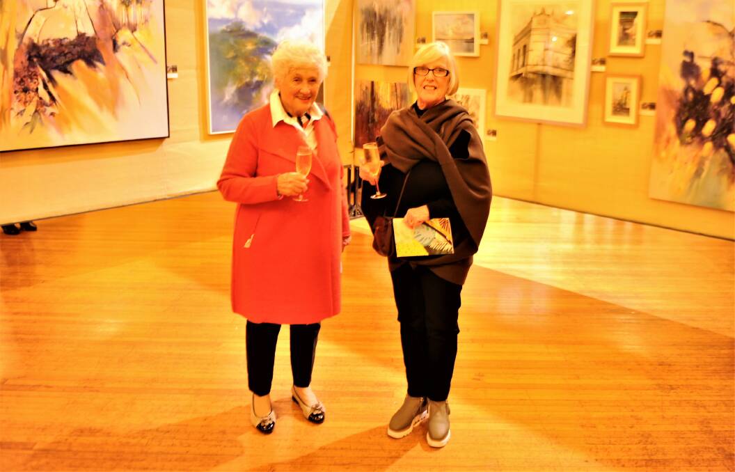 FRIENDS: Laharum's Marie Knight and Horsham's Pat Uytdehaag admire the works.