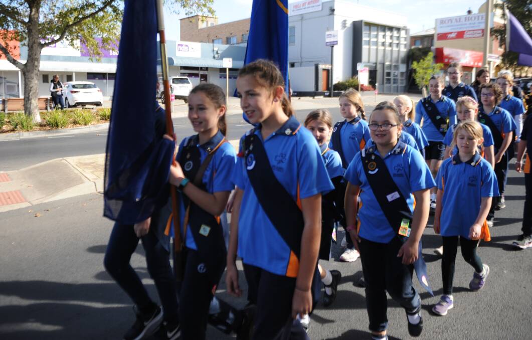 Members of Girl Guides Horsham march down Firebrace Street. Young people also took part in the parade as part of the Horsham Rural City Brass Band.