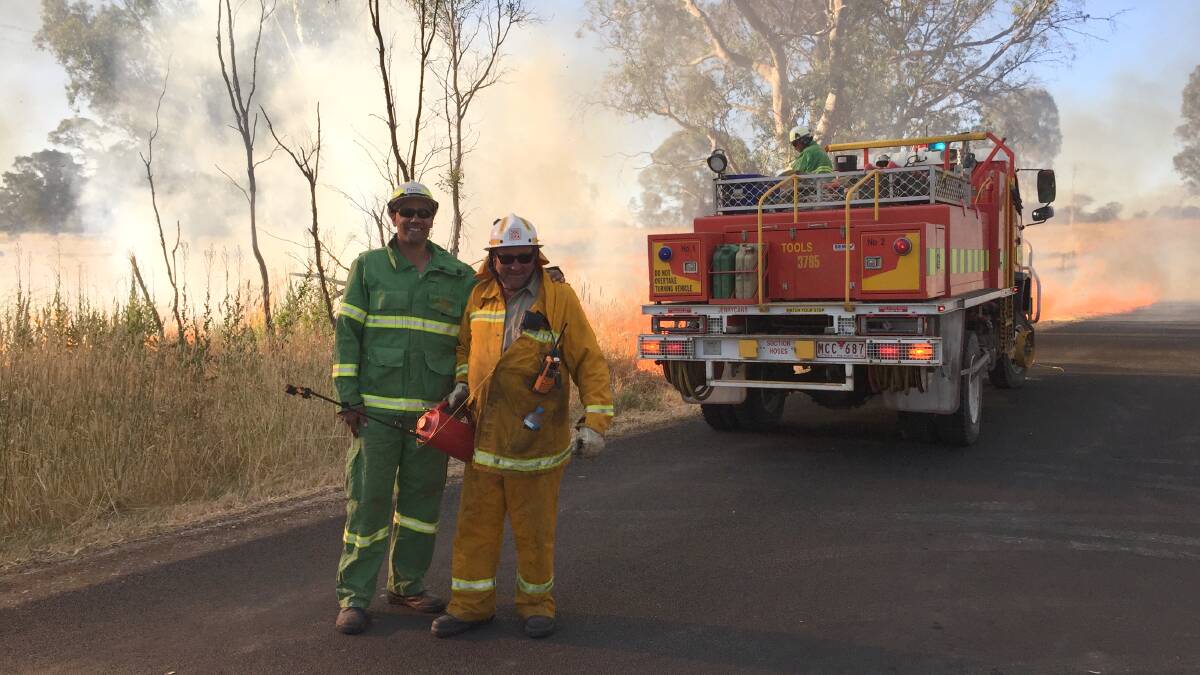 Left to Right: Forest Fire Management Victoria's Damian Skurrie with Country Fire Authority Apsley brigade member Stephen Hocking at the burn. Image: DELWP