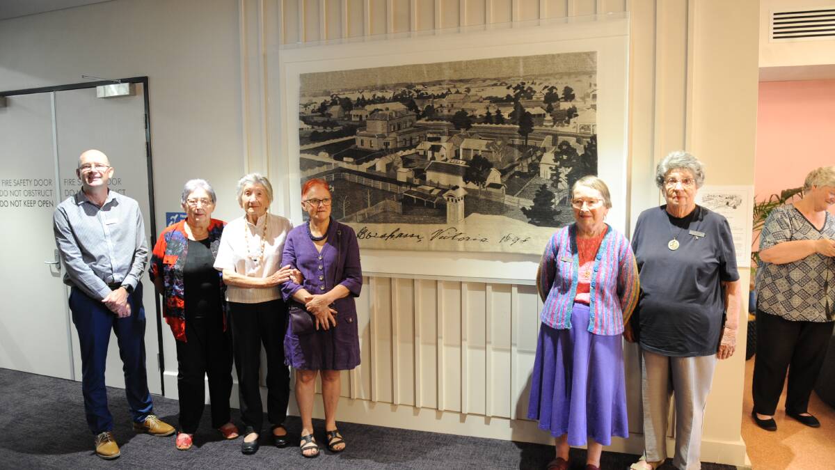 WONDER WEAVERS: Horsham Rural City Council Community Wellbeing Director Kevin O'Brien with original artists Joan Nester, Christine Osuchowski, Gill Venn, Gay Wilmot and Faye Crane. SECOND IMAGE: Ms Wilmot shows Mayor Mark Radford around the creation.