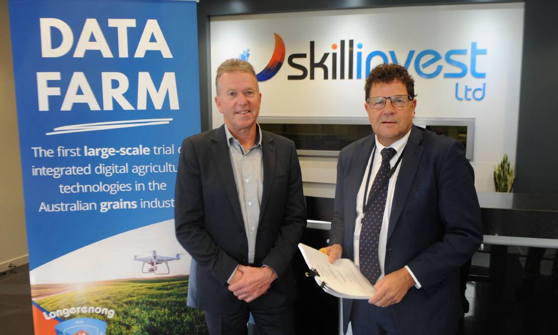 GOOD TO GO: Skillinvest chief executive Darren Webster and GWMWater managing director Mark Williams with the agreement signed on Tuesday. Picture: ALEXANDER DARLING
