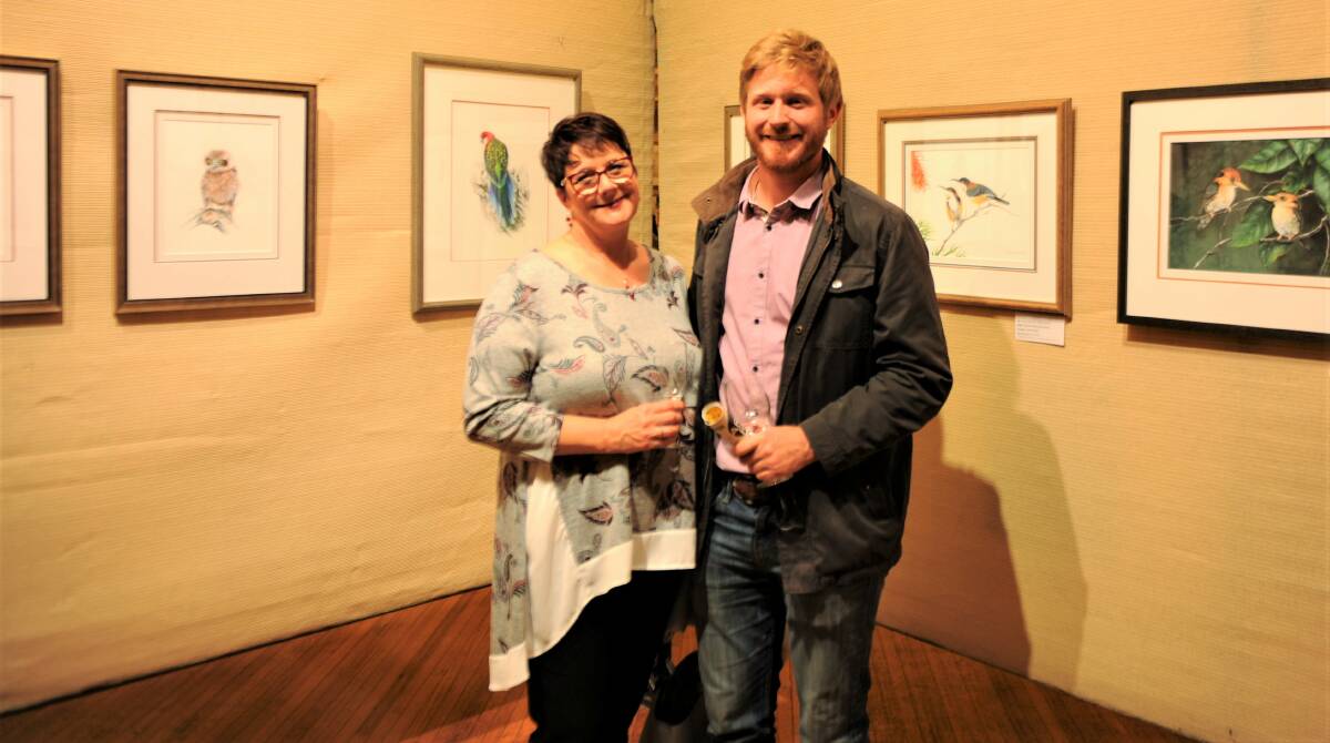 BIRDS OF A FEATHER: Jennifer and Cameron Taylor enjoying works by Horsham artist Debbie Russell.