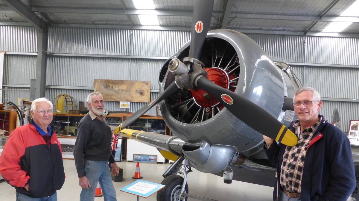 NAHC Board members John Deckert, Len Creek and Trevor Borgelt ready for the reopening of the Heritage Centre. They are pictured with a Wirraway the people of Nhill bought for $300,000. Picture; CONTRIBUTED