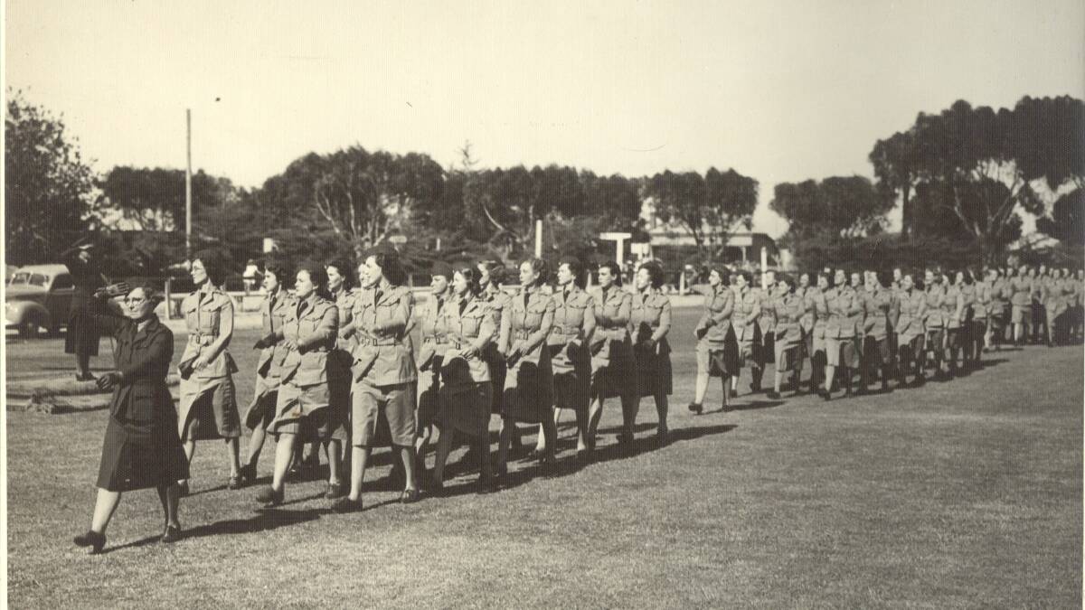 FORWARD MARCH: Women's Land Army members at Horsham City Oval in 1940. They are led by Rae Duncal. Picture: CONTRIBUTED