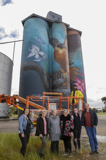 READY TO FLY THE FLAG FOR REGIONAL TOURISM: Members of West Wimmera Shire Counil and the town and district progress association stand in front of Kaniva's finished silo mural. Picture: CONTRIBUTED