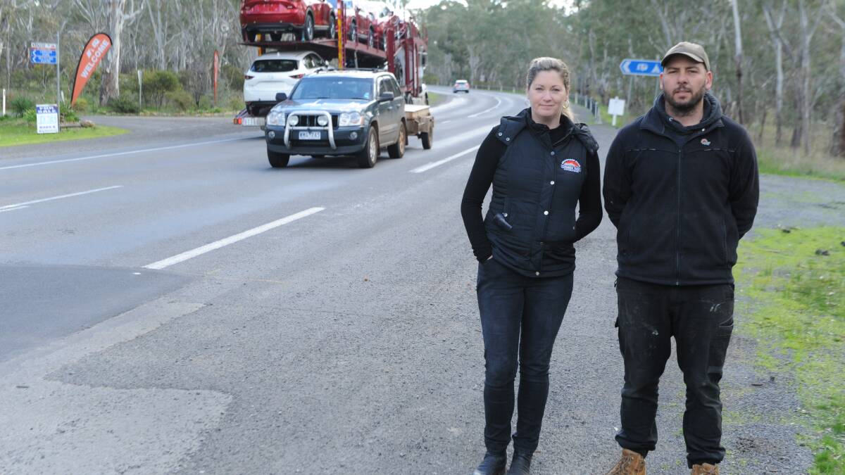 POTHOLE PANIC: Grampians Edge Caravan Park owners Stephen and Jennifer Vines, next to the potholes on the Western Highway at Dadswells Bridge. Picture: ALEXANDER DARLING
