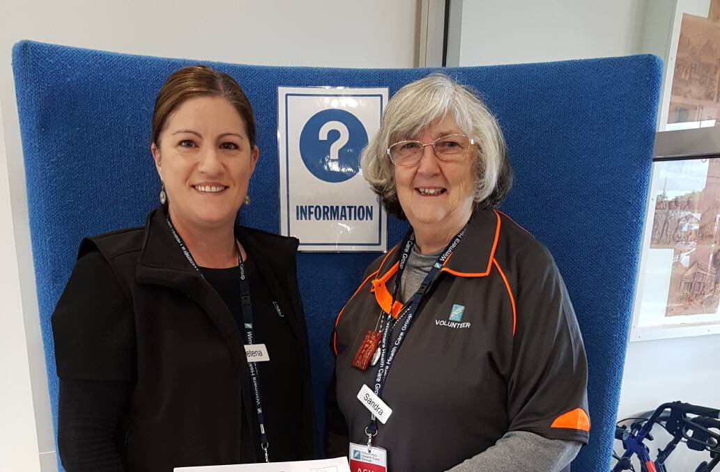 HELPING HAND: New Wimmera Base Hospital volunteer Sandra Bamkin with Wimmera Healthcare Group team member Petena Thomas. Picture: CONTRIBUTED