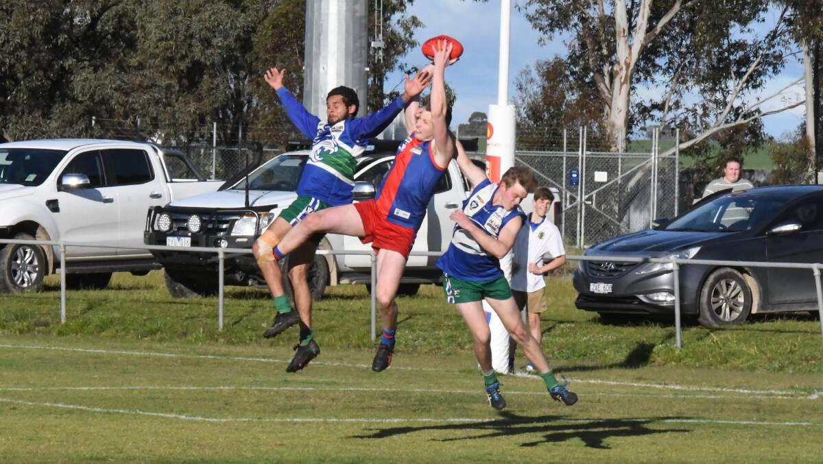 GRAB: Rupanyup's Jack Musgrove takes a strong mark near the goal square despite pressure from two defenders. Musgrove kicked 12 goals for the Panthers. Picture: BEN FRASER