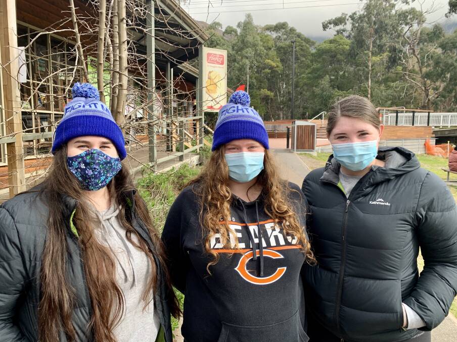 First time: This Saturday was the first time Samantha Hammerstein of Ararat, Jaymi Rousch of Great Western and Emily May of Ararat wear face masks in public. Picture: BEN FRASER