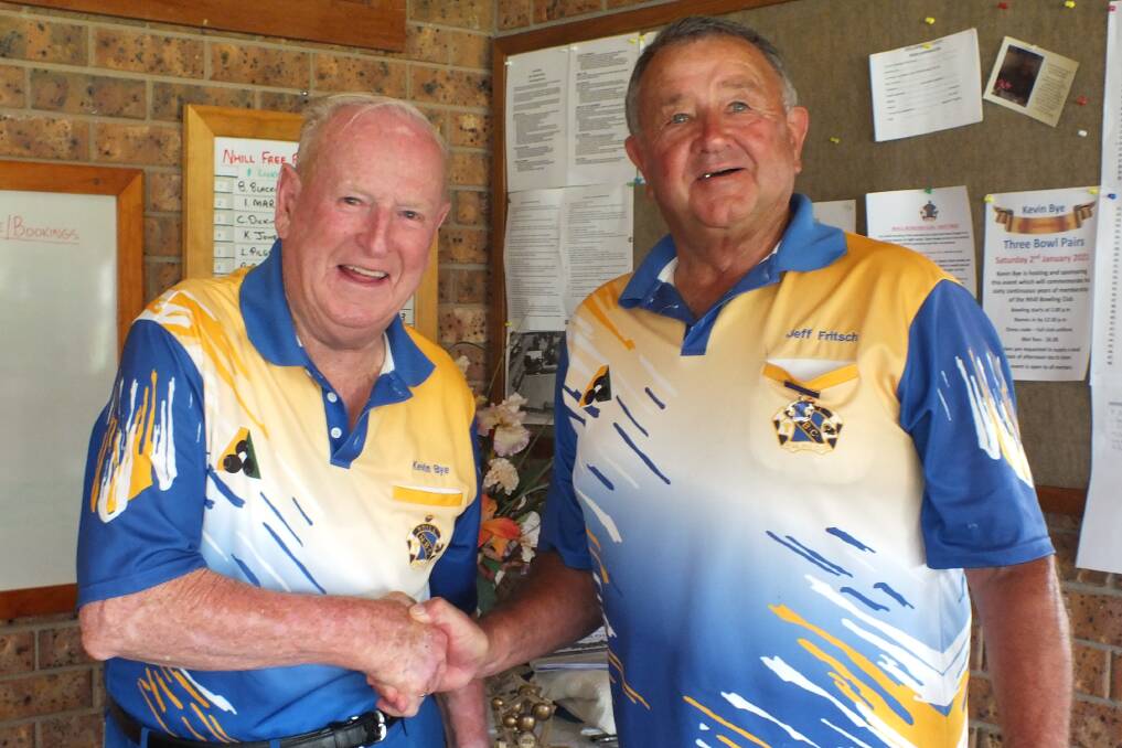 SIX DECADES: Kevin Bye being congratulated by Nhill Bowling Club President Jeff Fritsch for his 60 years with the club. Picture: CONTRIBUTED