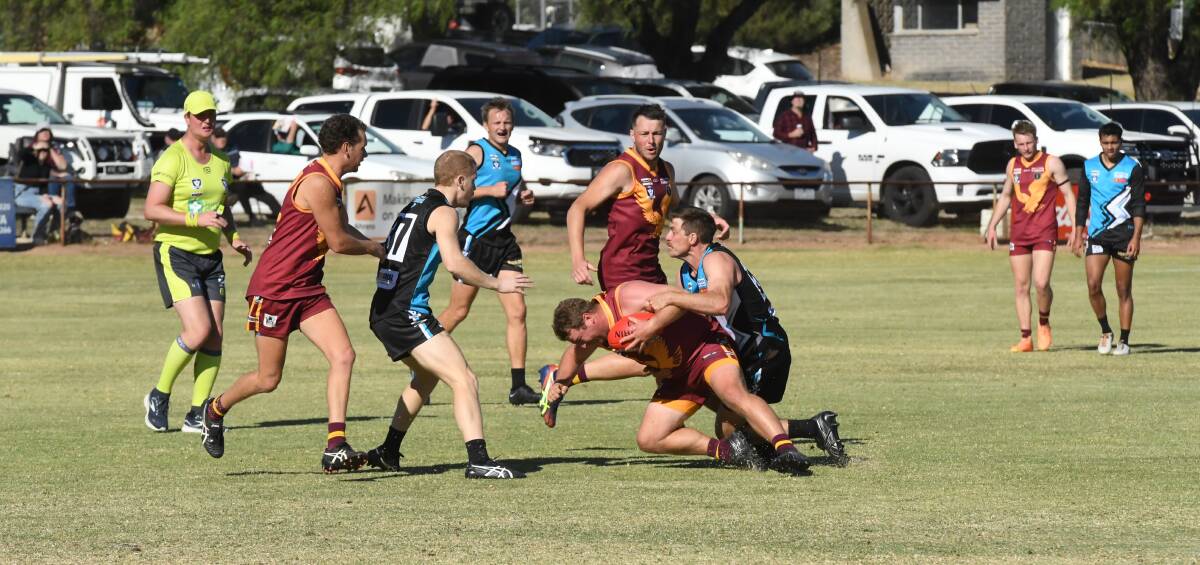 Tim Sanford makes a strong tackle during the WFNL round one match against Warrack at Sir Robert Menzies Park on Saturday, April 20. Picture by Lucas Holmes