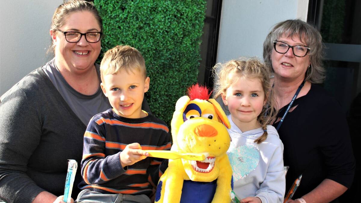 ALL SMILES: Goodstart Early Learning assistant director Jodie Rabl and WHCG Community Health nurse Janine Harfield with kinder children Lincoln and Isabella. Picture: CONTRIBUTED