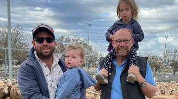 FAMILY ACTION: Dom and Leo Leach with Trevor Roelofs and Tess Leach, Walpeup, at Ouyen's recent sheep market.
