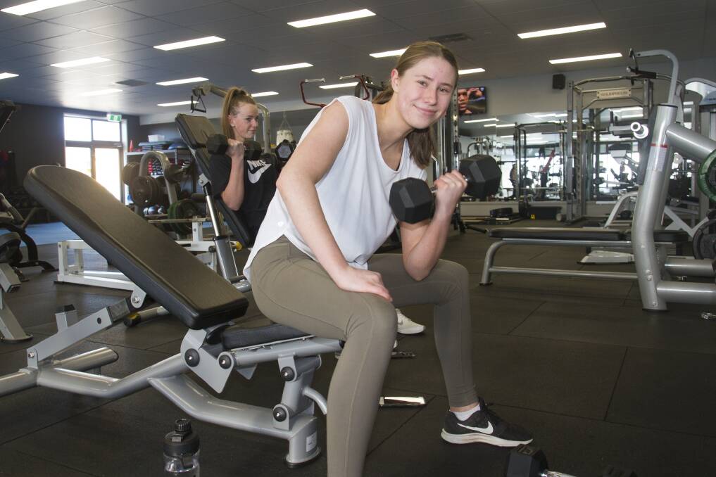 Tara Corcoran and Melanie Dent work out in the gym's opening week.