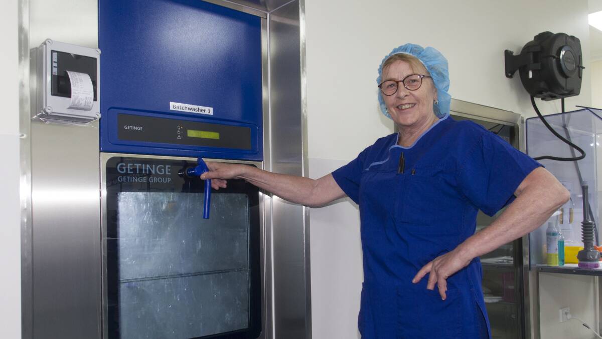 Anne Mansbridge monitors a cleaning machine