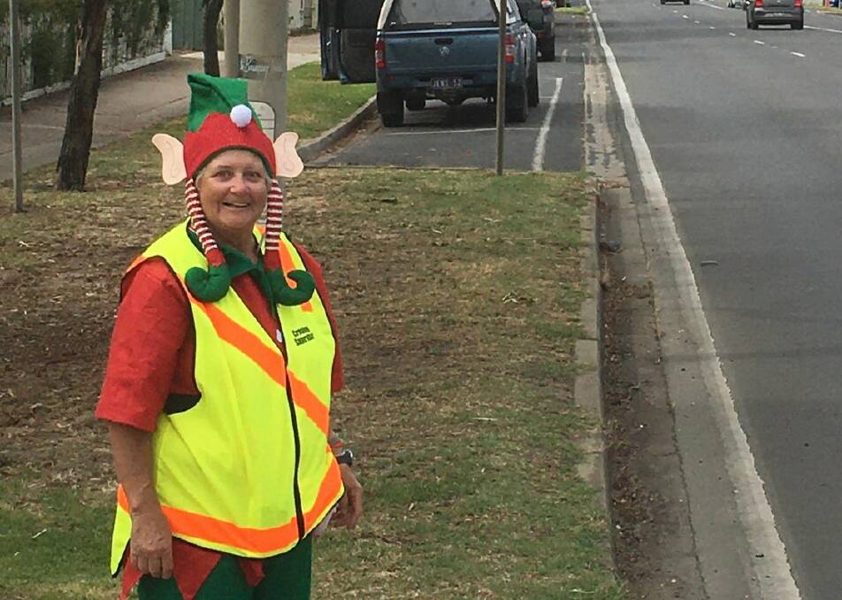 SAFETY FIRST: Jenny Smith, crossing lady, in a festive Elf outfit to give some Christmas cheer. 