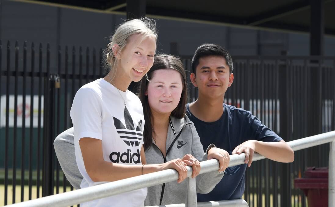 WAIT IS OVER: St Brigid's College's Tashana Meyer, Emmalee Anton, and Gerard Natividad are among the students who will receive their results today. Picture: SAMANTHA CAMARRI