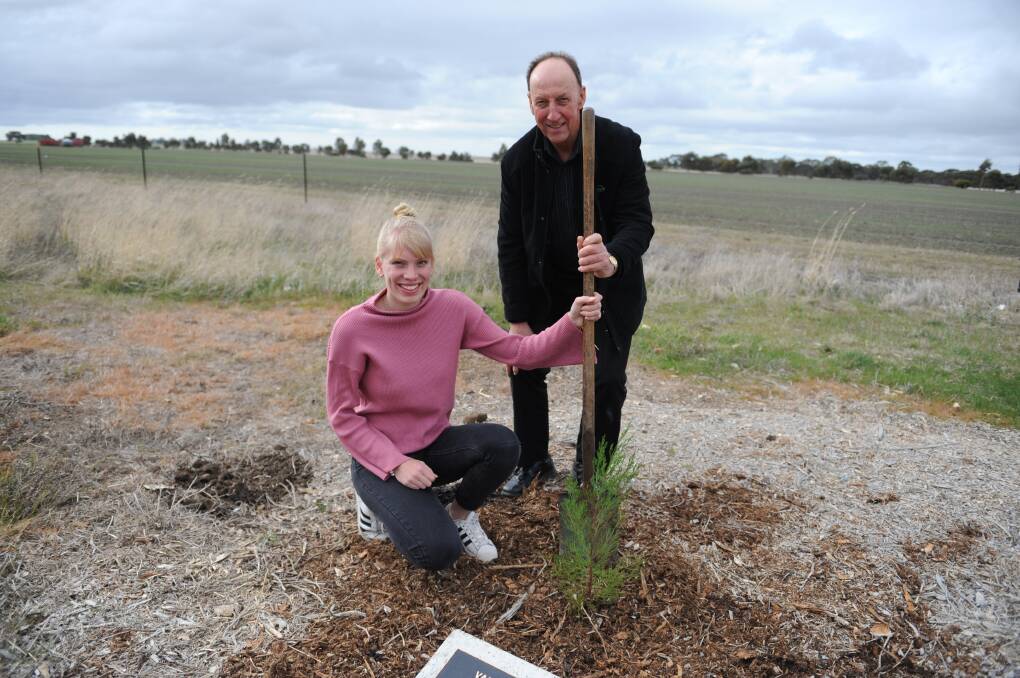 FAREWELL: Rotary exchange student Vanessa Six from Germany and Horsham East Rotary Club's past president Steven Holmes are planting a tree to commemorate Vanessa's visit to Horsham. Picture: DAINA OLIVER