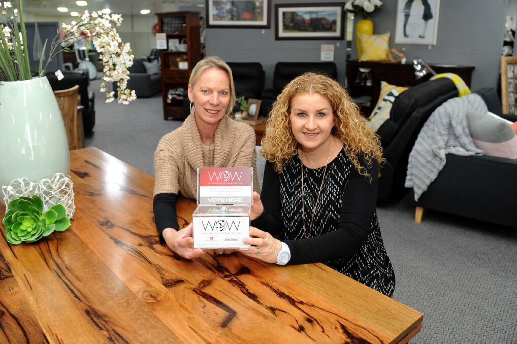 AWARD: Business Horsham's Wendy Mitchell and BJ's Furniture's Kellie Mann call on people to support the WOW Customer Service Program. Picture: SAMANTHA CAMARRI 