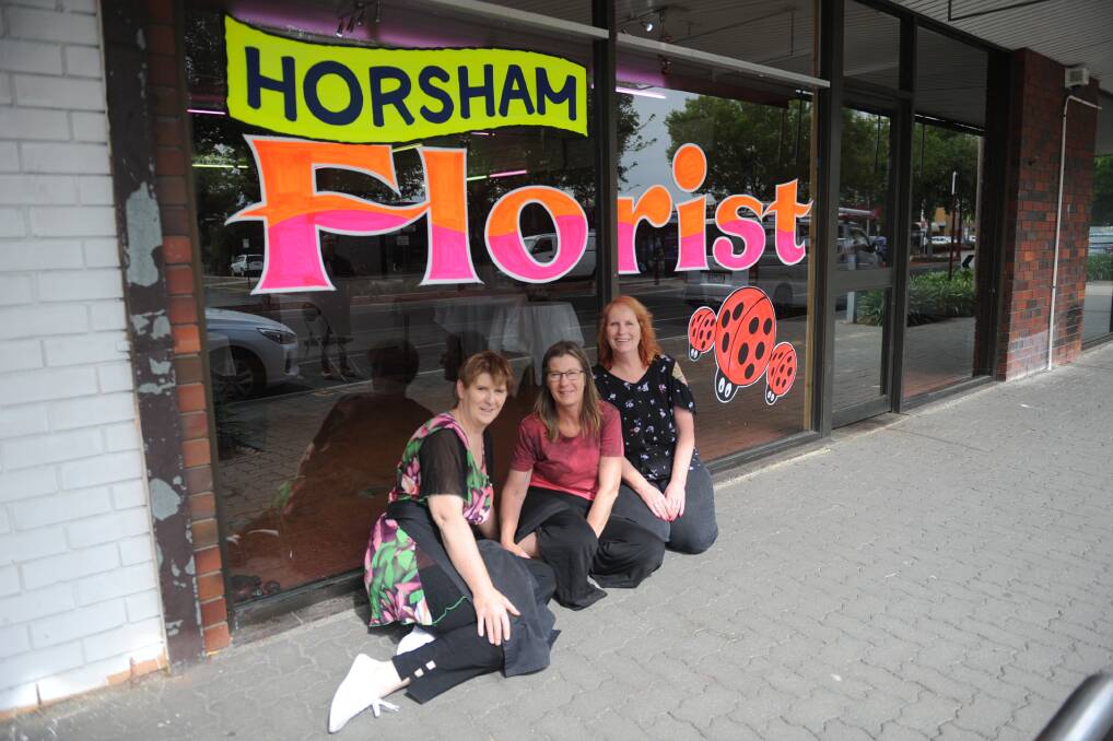 REOPENING: Horsham Florist owners Susan McQueen, Heather Harrison and Rosemary Arnott outside the temporary shop for the business. Picture: DAINA OLIVER