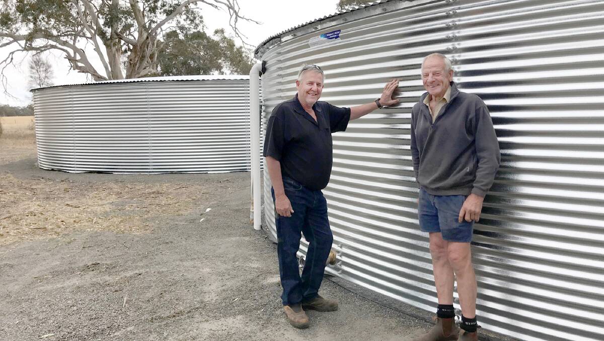 WAIT IS OVER: Horsham councillor David Grimble and Grampians Group officer Robert Kelm with the new tanks. Picture: SAMANTHA CAMARRI