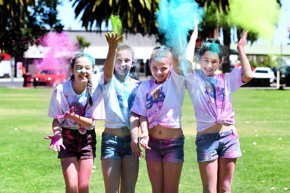 COLOUR WAR: Alexis Richards, Bianca Carr, Bella Carr, Georgia Taberner, Horsham, during a colour war at May Park for Youth C.A.N. Picture: SAMANTHA CAMARRI