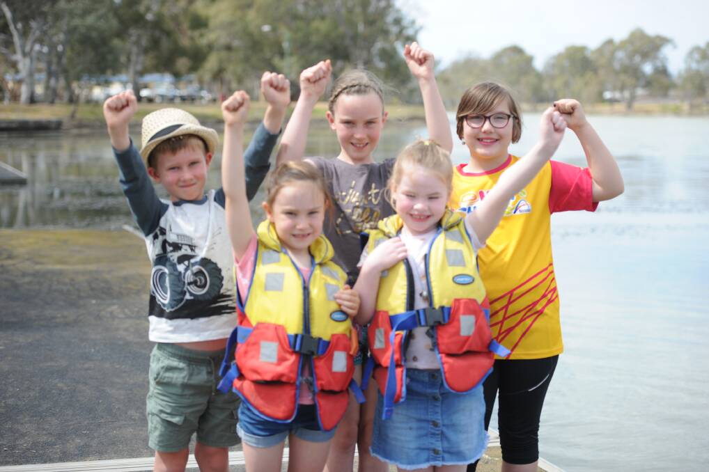 OVER THE MOON: Horsham's Ethan Hill, Emma Gellatly, Jade Edwards, Sarah Gellatly and Bella St Clair are excited for pedal boats on the Wimmera River. Picture: DAINA OLIVER