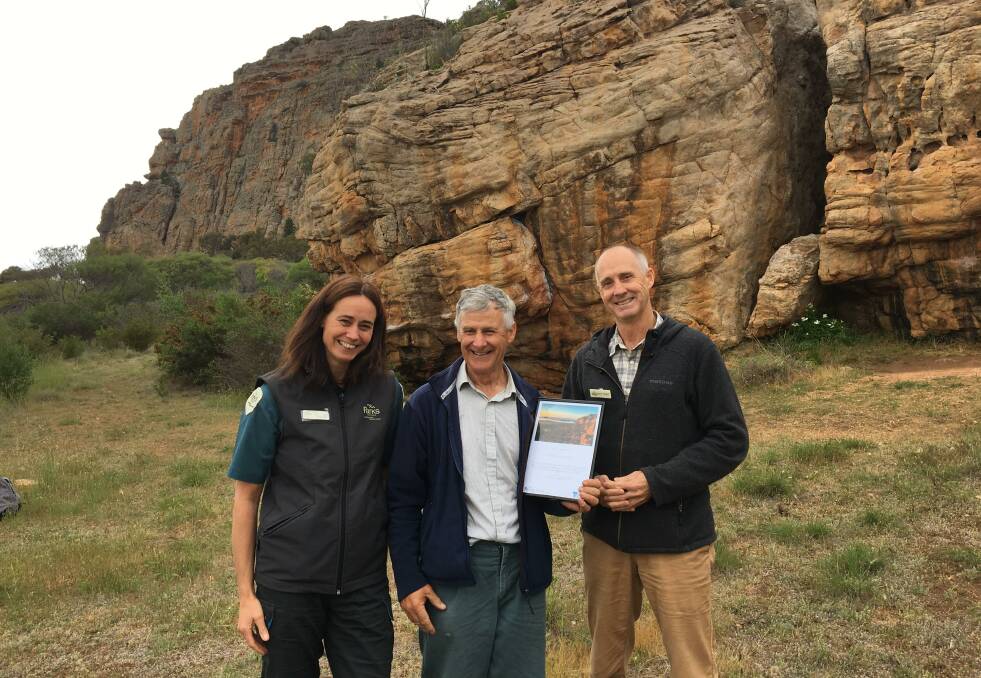 RECOGNITION: Parks Victoria Area Chief Ranger Zoe Wilkinson and Director Fire and Emergency David Nugent with Natimuk's Keith Lockwood who was recognised for 50 years of service to rock climbing rescues. Picture: CONTRIBUTED