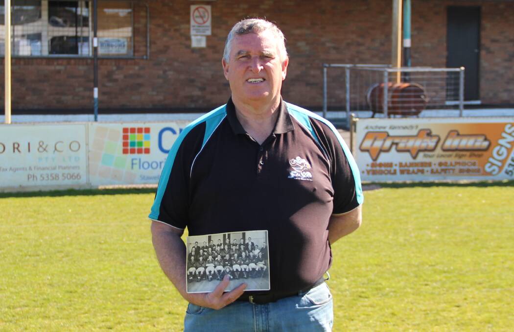 LIFETIME LOVE: Swifts vice-president Ian O’Donnell holds a picture of the Swifts 1959 team with him as its mascot. Picture: LACHLAN WILLIAMS