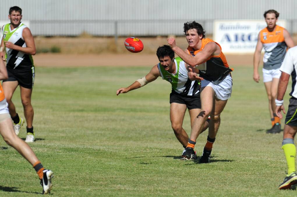 BREAKTHROUGH: Southern Mallee Giant Sam White getting a handball away when the side took on the Storm in round one. Picture: OLIVIA PAGE