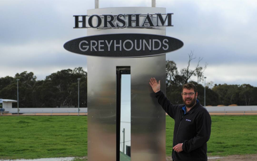 RARING TO GO: Horsham Greyhound Racing Club manager Justin Brilliant shows off the new finish line at the revamped Horsham greyhound track this week. Picture: ELIJAH MACCHIA 